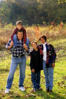 Children with parents in beautiful Fall color setting. Adult Adults Affection Affectionate Arm