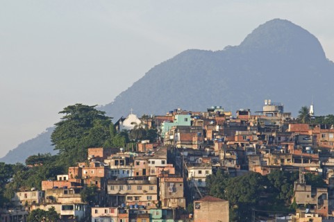 Rio de Janeiro, Brazil. Favela or slum above Saude neighbourhood brick houses trees Church and