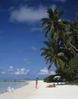 Beach, Maldives. Beach with tourists sunbathing next to the Indian Ocean. Maldives Island Islands