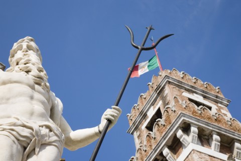 Venice, Veneto, Italy. Centro Storico Arsenale Part view of crenellated tower flying Italian