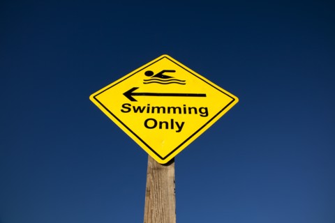 Shoreham-by-Sea, West Sussex, England. Sign indicating stretch of beach suitable for safe swimming.