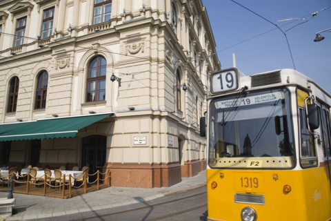 Budapest, Pest County, Hungary. Tram on bank of the River Danube Buda at approach to Chain Bridge.