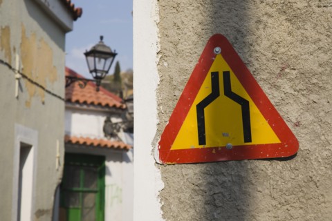 Samos Island, Northern Aegean, Greece. Vathy. Warning sign marking narrowing of street in old town.