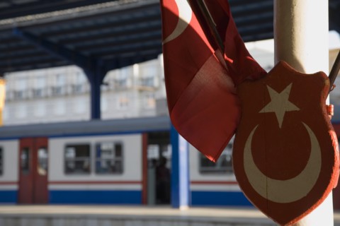 Istanbul, Turkey. Sultanahmet. Istanbul Sirkeci Terminal Turkish flag and emblem in foreground with