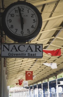 Istanbul, Turkey. Sultanahmet. Station clock giving time of three minutes to six on platform with