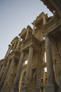 Selcuk, Izmir Province, Turkey. Ephesus. Roman Library of Celsus facade with young woman standing