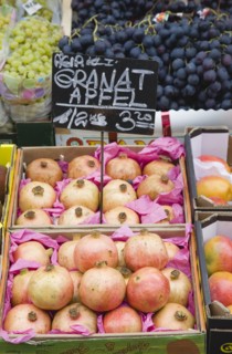 Vienna, Austria. The Naschmarkt. Display of fresh fruit for sale on market stall with grapes and
