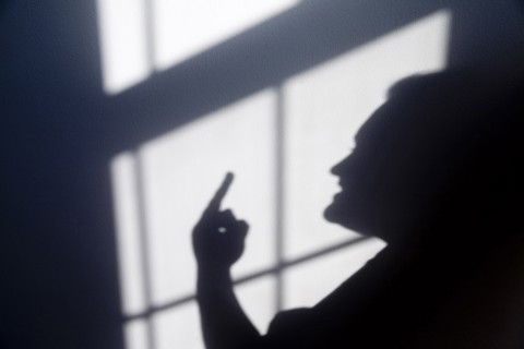 Shadow of a person giving a hand gesture Flipping the Bird. Anger Angry Annoyed Day Daytime Gesture
