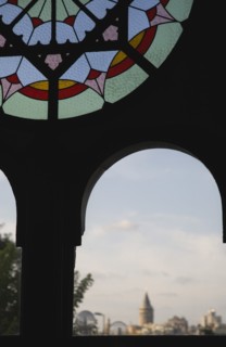 Istanbul, Turkey. Sultanahmet. Part view of dirty stained glass window in Ottoman era waiting room