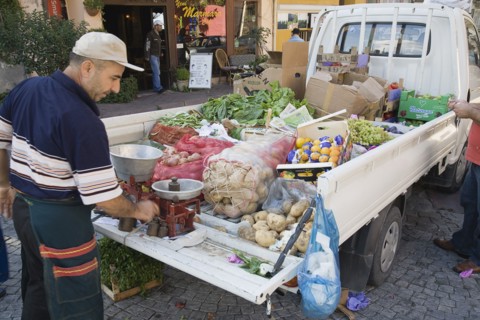 Istanbul, Turkey. Sultanahmet. Fresh produce arrives by truck for local shoppers with set of scales