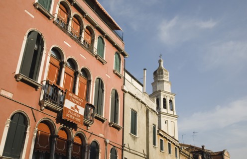 Venice, Veneto, Italy. Centro Storico Restored facade of building painted a terracotta colour with