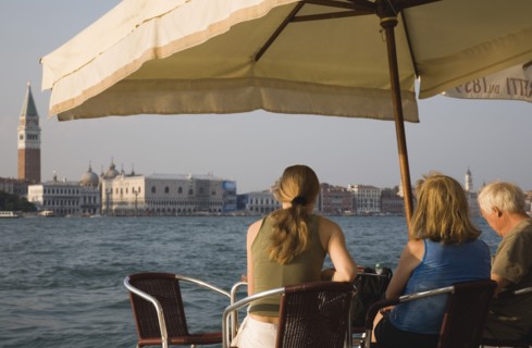 Venice, Veneto, Italy. Giudecca island Tourists enjoying lunch at terrace cafe in Centro Storico