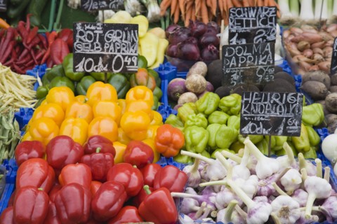 Vienna, Austria. The Naschmarkt. Fresh produce stall with display including chillies peppers garlic