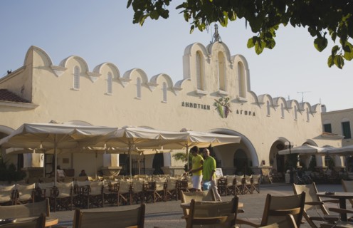 Kos, Dodecanese Islands, Greece. Kos Town Agora market in Summer sun with holidaymakers walking