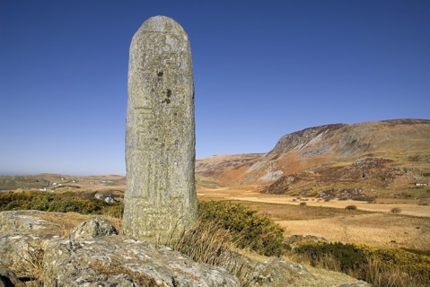 Glencolumbkille, County Donegal, Ireland. Pilgrimage station pillar with mountains in the