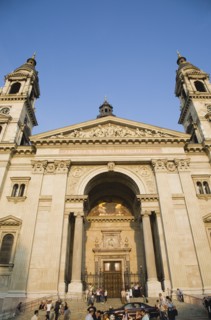 Budapest, Pest County, Hungary. Exterior facade of Saint Stephens Basilica with crowd of visitors