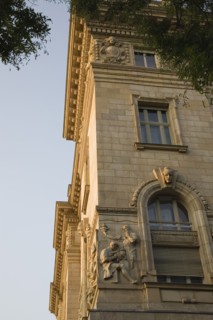 Budapest, Pest County, Hungary. Part view of exterior facade of building with bas relief carving of