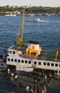 Istanbul, Turkey. Sultanahmet Bosphorous passenger ferry at sunset with people boarding. Turkey