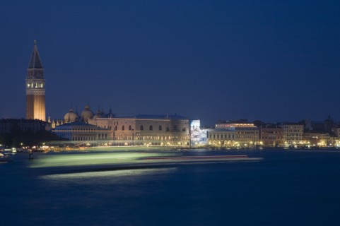 Venice, Veneto, Italy. Giudecca island Early evening view towards illuminated Campanile of St. Mark