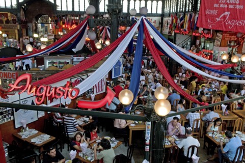 Santiago, Chile. Seafood restaurant section of Central Market with diners at tables eating under