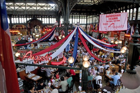 Santiago, Chile. Seafood restaurant section of Central Market with diners eating at tables under