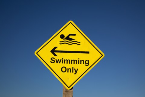 Shoreham-by-Sea, West Sussex, England. Sign indicating stretch of beach suitable for safe swimming.