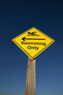 Shoreham-by-Sea, West Sussex, England. Sign indicating stretch of beach suitable for safe swimming.
