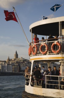 Istanbul, Turkey. Sultanahmet. Crowded passenger ferry flying Turkish flag on the Bosphorous with