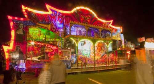 Lancing, West Sussex, England. Entertainment Funfairs Rides illuminated at night. England English