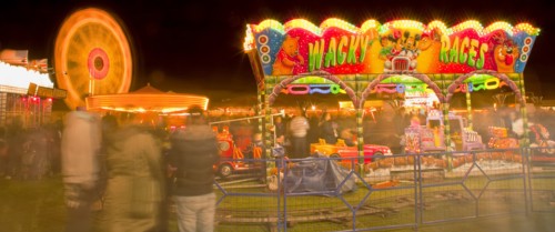 Lancing, West Sussex, England. Entertainment Funfairs Rides illuminated at night. England English