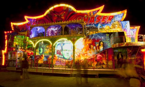 Lancing, West Sussex, England. Entertainment Funfairs Rides illuminated at night. England English