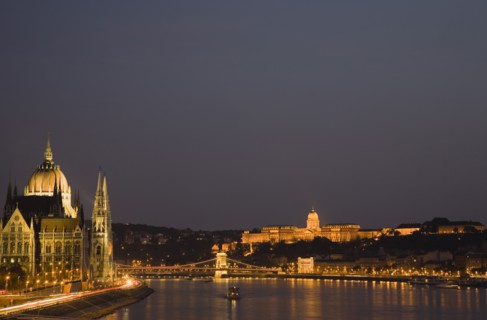 Budapest, Hungary. View along the River Danube at night with the Parliament building on the left
