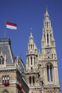 Vienna, Austria. Rathaus detail of roof and towers with red and white flag flying. Austria Austrian