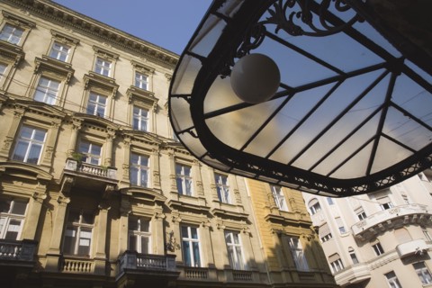 Budapest, Pest County, Hungary. Art Nouveau era apartment exterior facades with part seen underside
