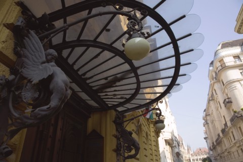 Budapest, Pest County, Hungary. Art nouveau building facade and apartment entrance with decorative