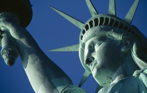 New York City, New York State, USA. The Statue of Liberty. Detail of head and arm holding torch