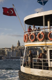 Istanbul, Turkey. Sultanahmet. Crowded passenger ferry flying Turkish flag on the Bosphorous with