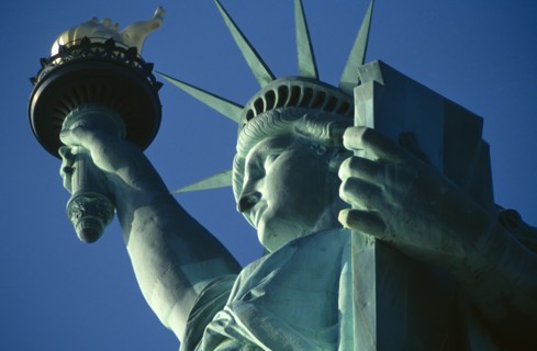 New York City, New York State, USA. The Statue of Liberty. Detail of head and arm holding torch