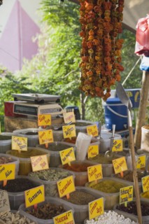 Kusadasi, Aydin Province, Turkey. Stall at weekly market selling spices and chilies in brightly