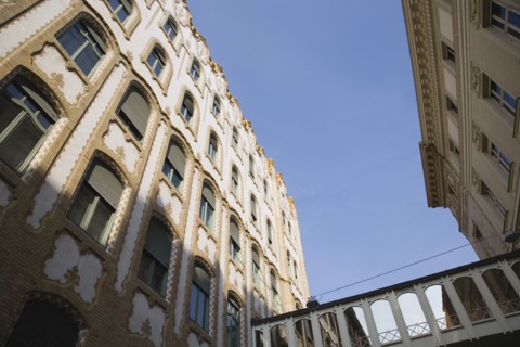 Budapest, Pest County, Hungary. Angled view of renovated apartment buildings exterior facade.