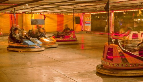 Lancing, West Sussex, England. Entertainment Funfairs Rides Dodgems illuminated at night. England