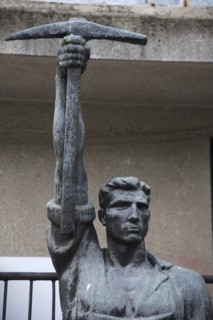Tirana, Albania. Statue of communist worker holding pickaxe. Albanian Shqip‘ria Southern Europe