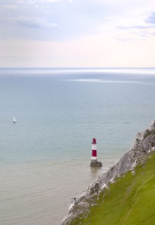 Eastbourne, East Sussex, England. Beachy Head view of the lighthouse at the base of the chalk