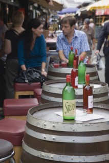 Vienna, Austria. Young couple having glass of Federweisser wine in the fermentation stage known as