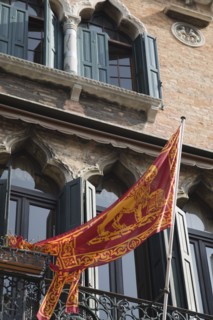 Venice, Veneto, Italy. Centro Storico Republic of Venice flag depicting winged lion of St. Mark on