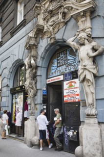 Budapest, Pest County, Hungary. Art Nouveau sculpture on facade of apartment building with local