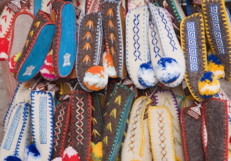 Athens, Attica, Greece. Traditional footwear on sale in the Plaka district lying just beneath the