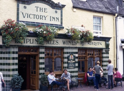 Brighton, East Sussex, England. Victory Inn Public House on Duke Street. People sitting at tables