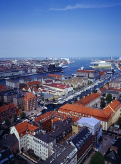 Denmark, Copenhagen, View north over city rooftops and harbour from the tower of the Church of Our