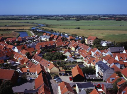 Denmark, Ribe, View west over city rooftops towards farmland and the River Ribea from the twelth